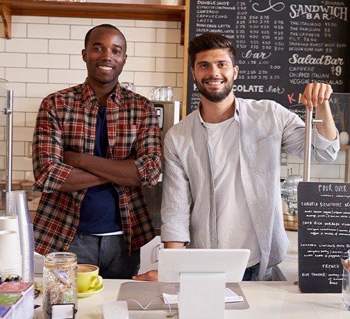 Two Men behind a counter