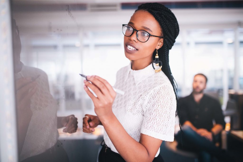 black office pen writing writing woman notes meeting small business brainstorming business woman