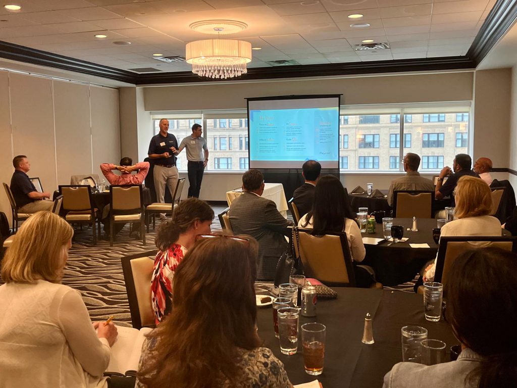 Rob Wickard and Ben Deighton of Paycor presenting to an IEE audience at Rivers Club